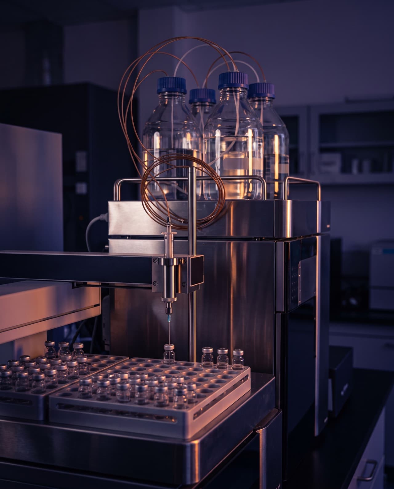 Laboratory analysis illustration: HPLC autosampler with solvent bottles and sample vials
