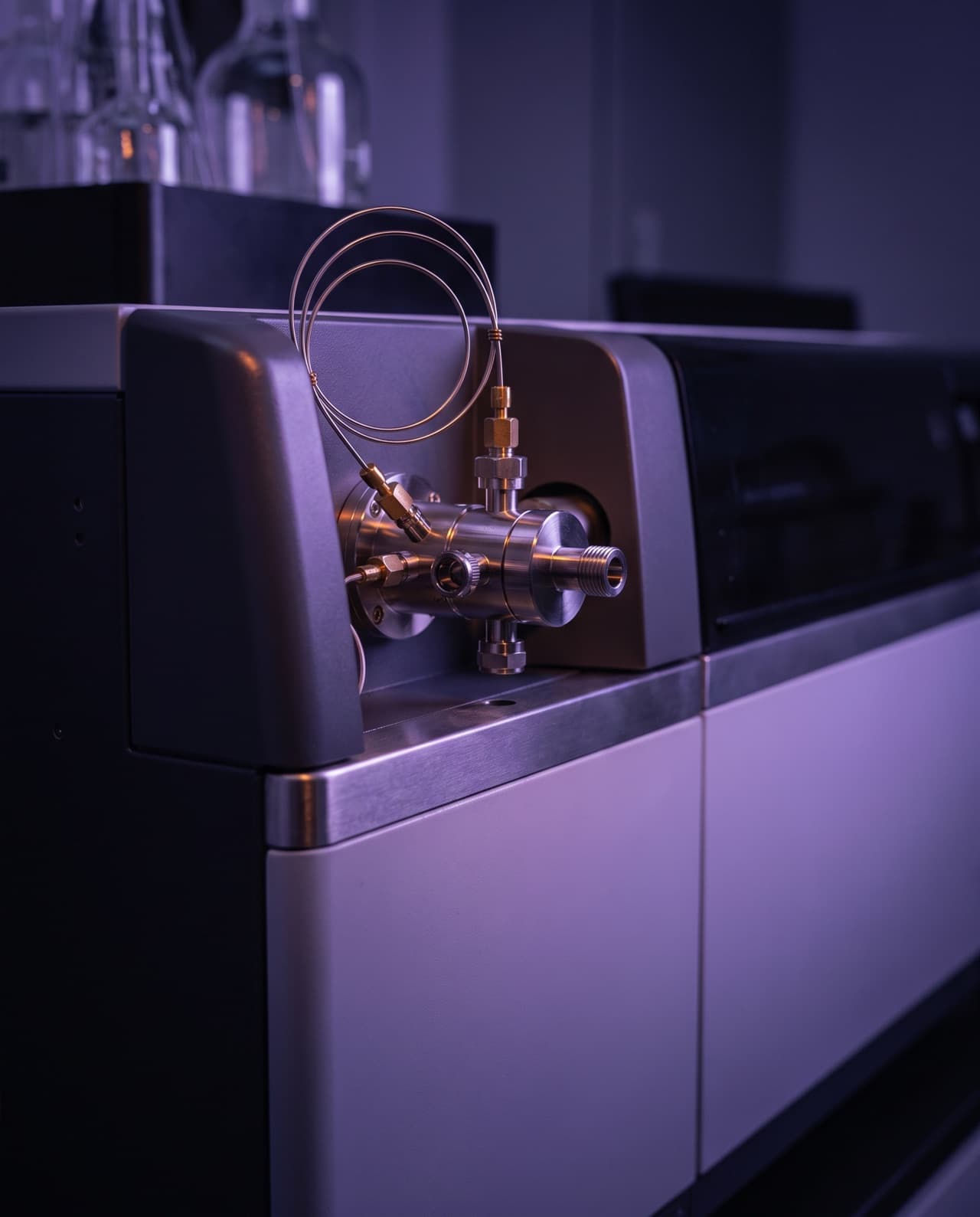 Laboratory analysis illustration: mass spectrometer ion source with capillary tubing
